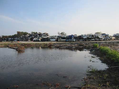 Figure 8. A pile of tsunami damaged cars awaiting crushing.